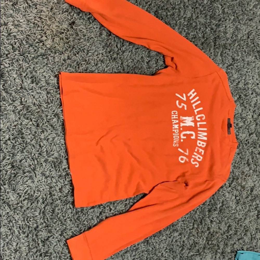 A orange long sleeve
